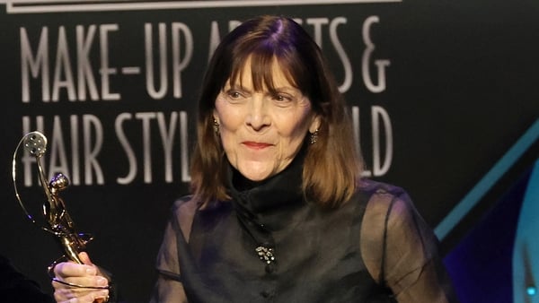 BEVERLY HILLS, CALIFORNIA - FEBRUARY 19: Michèle Burke, winner of the Lifetime Achievement Award for Make-Up, speaks onstage during the 9th Annual Make-Up Artists & Hair Stylists Guild Awards at The Beverly Hilton on February 19, 2022 in Beverly Hills, Ca