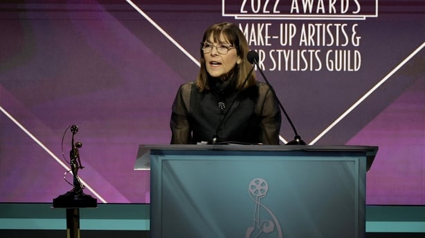 BEVERLY HILLS, CALIFORNIA - FEBRUARY 19: Michèle Burke, winner of the Lifetime Achievement Award for Make-Up, speaks onstage during the 9th Annual Make-Up Artists & Hair Stylists Guild Awards at The Beverly Hilton on February 19, 2022 in Beverly Hills, California. (Photo by Kevin Winter/Getty Images