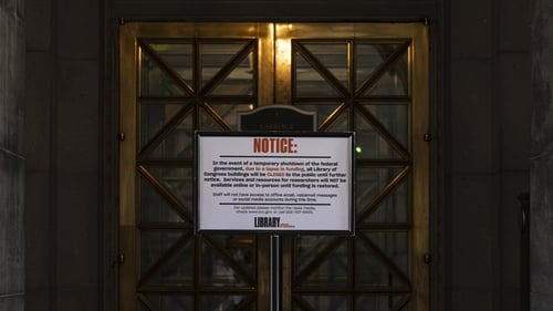 A closure notice is posted at the entrance of the Library of Congress in Washington DC