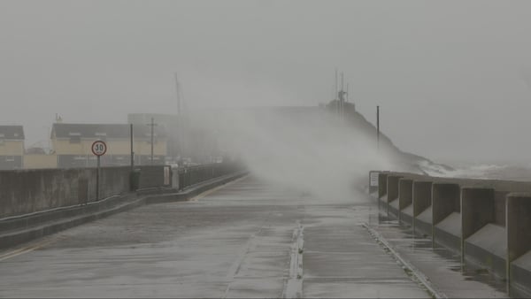 Waves crashing into Fenit Pier in Kerry