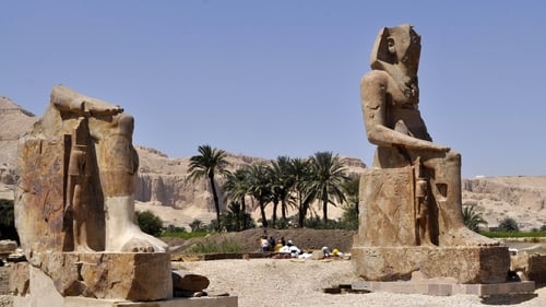 Statues of pharaoh Amenhotep III (R) and his wife Tiye displayed in Egypt's temple city of Luxor (Photo: /AFP via Getty Images)