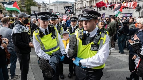 Police arrest an activist in Trafalgar square, London for defying the Palestine Action ban