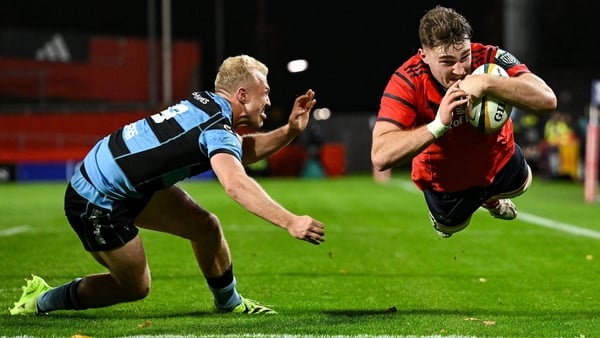 4 October 2025; Ruadhan Quinn of Munster scores his side's first try despite the efforts of Johan Mulder of Cardiff Rugby during the United Rugby Championship match between Munster and Cardiff Rugby at Thomond Park in Limerick. Photo by Brendan Moran/Spor