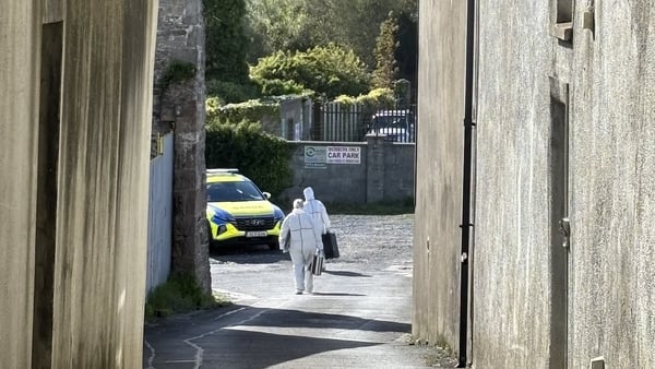 a forensic officer at work at a crime scene
