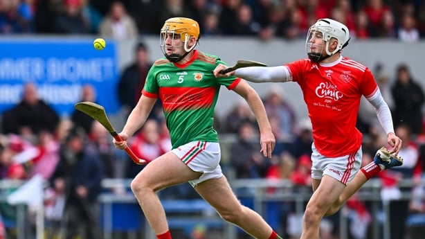Darragh Keogh of Clooney Quin (L) in action against Marco Cleary of Éire Óg Ennis - 2025 Clare hurling final