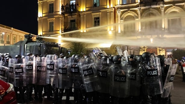 Riot police disperse protesters during an opposition rally on the day of local elections in central Tbilisi