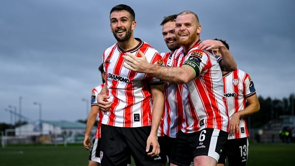Derry City goalscorer Michael Duffy, left, celebrates with team-mates Cameron Dummigan, centre, and Mark Connolly, right
