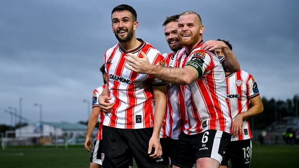 Derry City goalscorer Michael Duffy, left, celebrates with team-mates Cameron Dummigan, centre, and Mark Connolly, right