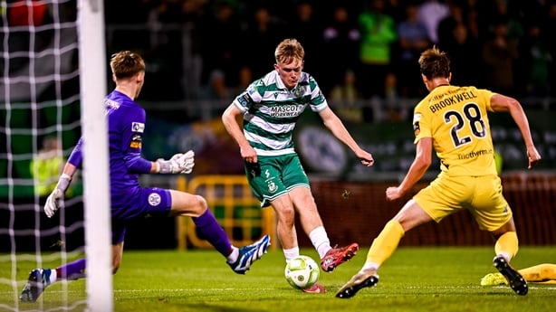 5 October 2025; Michael Noonan of Shamrock Rovers scores his side's fifth goal past Kerry FC goalkeeper Darragh Foley, left, and Niall Brookwell of Kerry FC during the Sports Direct Men's FAI Cup semi-final match between Shamrock Rovers and Kerry FC at Tallaght Stadium in Dublin. Photo by Ben McShan