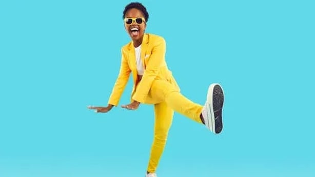 woman high kicking and laughing