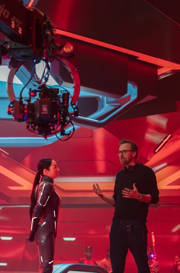 (L-R) Greta Lee and Director Joachim Rønning on the set of Tron Ares Photo by Leah Gallo