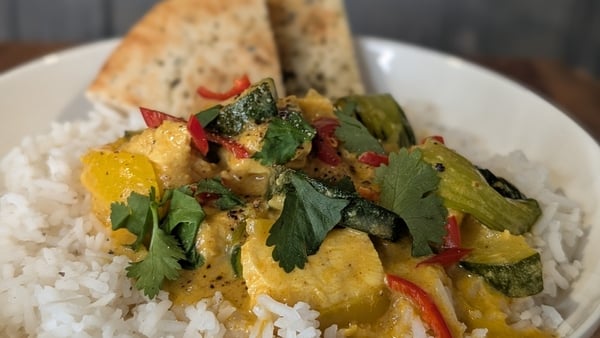 A bowl of yellow curry on rice