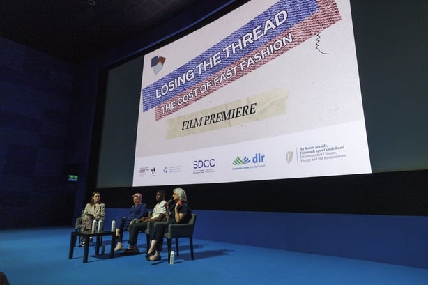 Four women - Jo Linehan, Carrie Ann Moran, Danson Matekwa and Joanne Rourke - sitting on chairs in front of a cinema screen