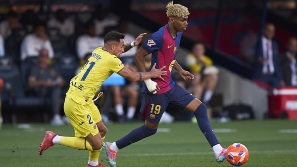 BARCELONA, SPAIN - MAY 18: Lamine Yamal of FC Barcelona competes for the ball with Yeremy Pino of Villarreal CF during the LaLiga match between FC Barcelona and Villarreal CF at Estadi Olimpic Lluis Companys on May 18, 2025 in Barcelona, Spain. (Photo by