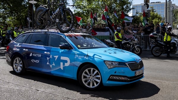 VALLADOLID, SPAIN - SEPTEMBER 11: The car of Israel - Premier Tech team is seen in front of a group of Pro Palestinian protesters during the La Vuelta - 80th Tour of Spain 2025, Stage 18 a 12.2km individual time trial stage on September 11, 2025 in Vallad