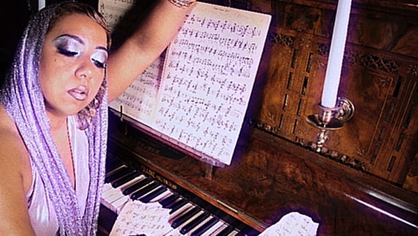 US singer Jen awad at piano