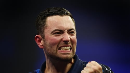 Luke Humphries celebrates his win over Nathan Aspinall