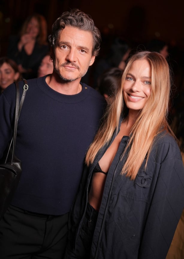 Pedro Pascal and Margot Robbie at the Chanel fashion show as part of Spring/Summer 2026 Paris Fashion Week held at Grand Palais on 6 October, 2025 in Paris