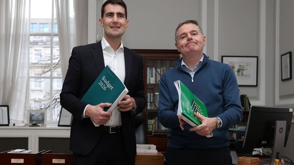 Jack chambers and Pascal Donohoe stand beside each other in an office
