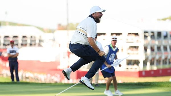 Shane Lowry of Team Europe holes the vital putt on the 18th green that secures the Ryder Cup for Europe