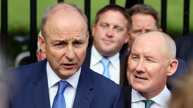 Micheal Martin stands beside Jim Gavin 