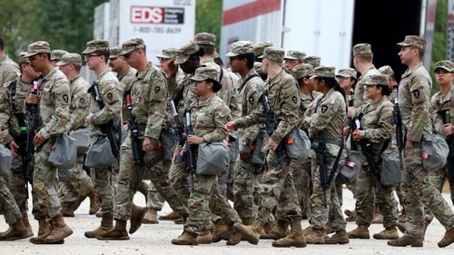 Members of the Texas National Guard assemble in Elwood, Illinois, at the Army Reserve Training Center