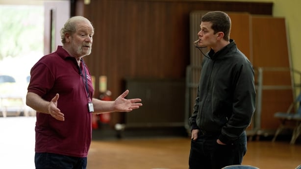 Tommy (Peter Mullan) explains the Community Centre job to John (Robert Aramayo) in I Swear