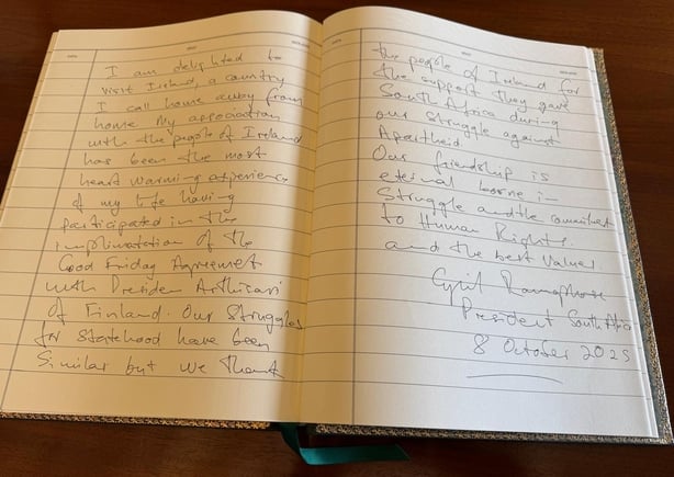 The guest book signed by Cyril Ramaphosa
