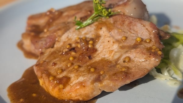 Pork chops on a plate with sauce