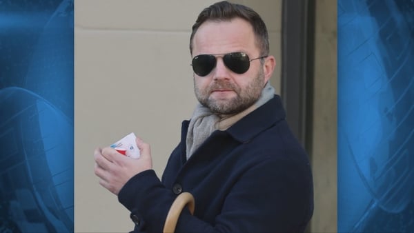 Michal Luczak looks to camera with sunglasses on.
