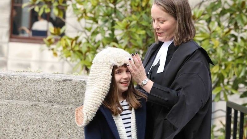 Nine-year-old Martha Harris trying on the wig of her aunt, newly-appointed Senior Counsel Diana Stuart