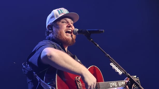 Luke Combs performing onstage