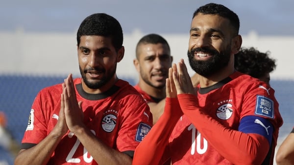 Egypt's forward #20 Ibrahim Adel celebrates with forward #10 Mohamed Salah after scoring his team's first goal during the FIFA World Cup 2026 Africa qualifier football match between Djibouti and Egypt at the Larbi Zaouli Stadium in Casablanca