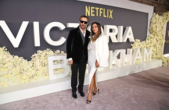 Fashion designer with a former Spice Girl on red carpet