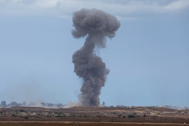 A smoke plume billows following Israeli bombardment on the Gaza Strip as pictured from across the border in southern Israel on October 9, 2025. Israel and Hamas on October 9 agreed a Gaza ceasefire deal to free the remaining living hostages, in a major step towards ending a war that has killed tens