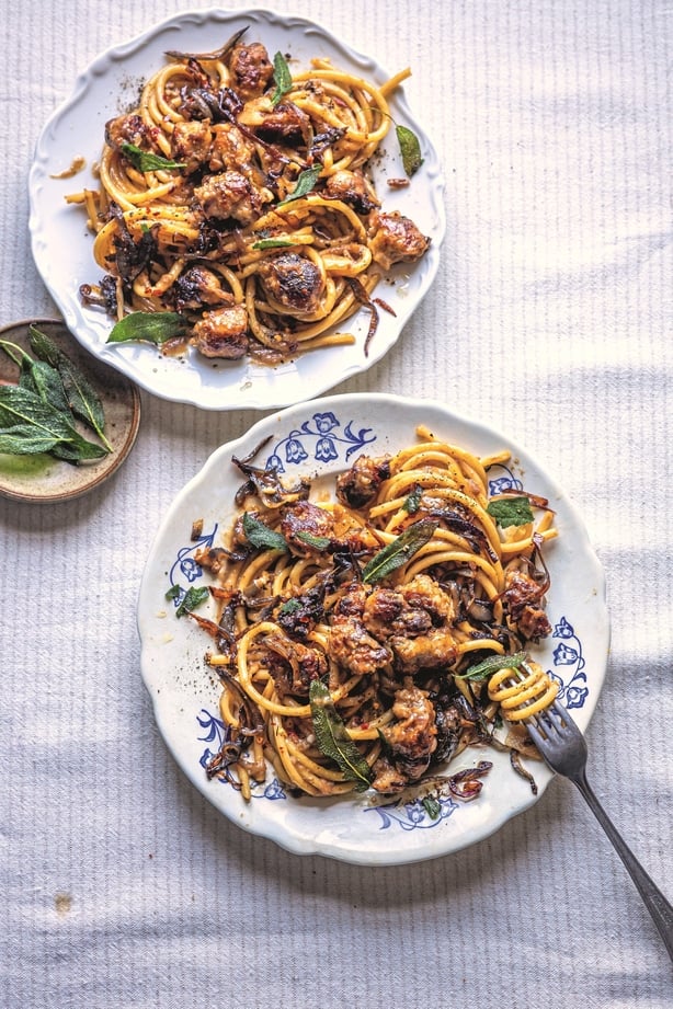 Two bowls of pasta with sausage