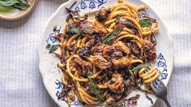 a bowl of pasta with sausage