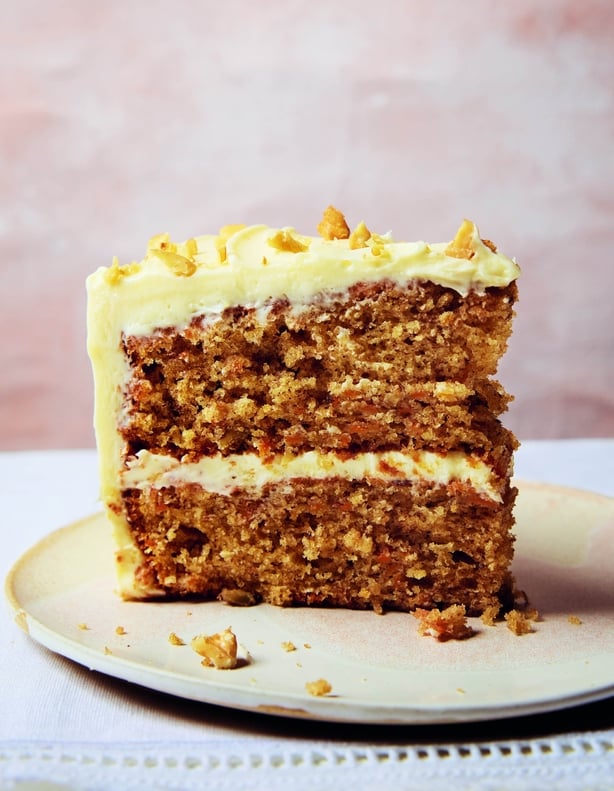 A slice of frosted cake on a plate