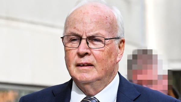 Image of an elderly business man in a suit