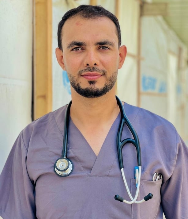 Waleed in his scrubs is an emergency care nurse in Khan Younis