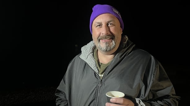 Member of Blueballs Midlands, Enda Battle, holds a cup