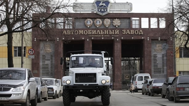 A white truck in front of the Gorky Automobile Plant in Russia 