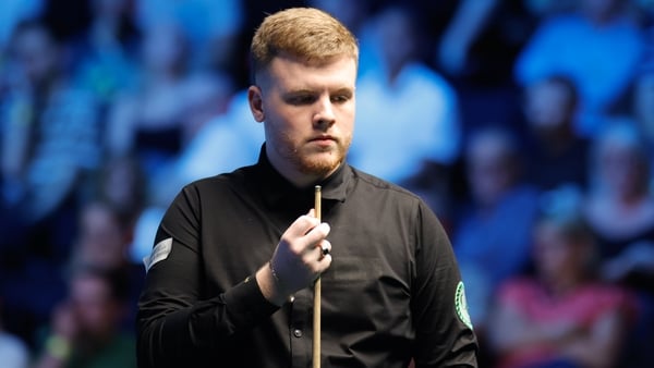 Aaron Hill of Ireland chalks the cue in the Quarterfinal match against Jak Jones of Wales on day 9 of 2025 BetVictor English Open at the Brentwood Leisure Centre on September 19, 2025 in Brentwood, England.