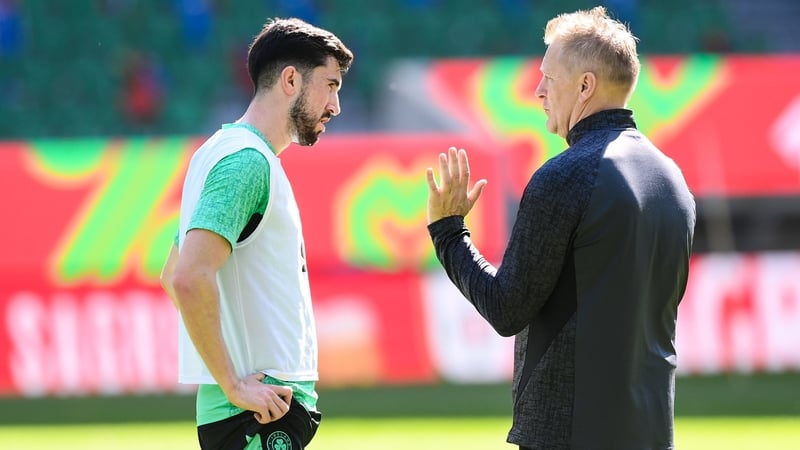 Finn Azaz and Heimir Hallgrimsson having a discussion at the stadium in Lisbon ahead of Saturday's clash with Portugal