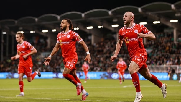 10 October 2025; Kerr McInroy of Shelbourne, right, celebrates with teammates Milan Mbeng, centre, and Harry Wood after scoring his side's first goal during the SSE Airtricity Men's Premier Division match between Shamrock Rovers and Shelbourne at Tallaght Stadium in Dublin. Photo by Thomas Flinkow/S