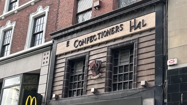 The exterior of Footlocker on O'Connell Street showing the Confectioners Hall sign.