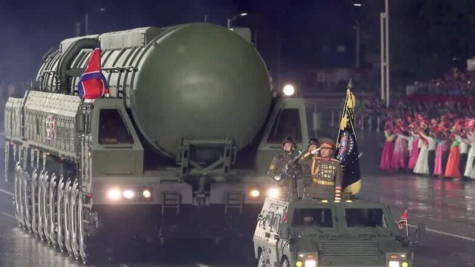 North Korea holds military parade, shows off new missile