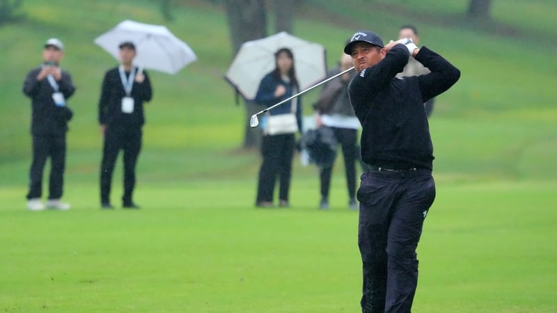 Xander Schauffele moved to the top of the leaderboard in wet conditions