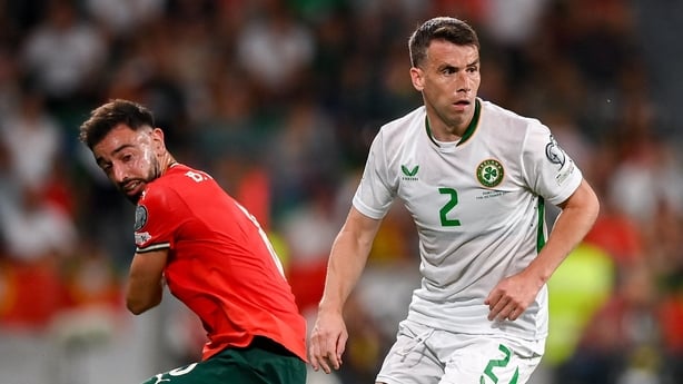 Seamus Coleman of Republic of Ireland in action against Bruno Fernandes of Portugal during the FIFA World Cup 2026 Group F qualifying match between Portugal and Republic of Ireland at Estádio José Alvalade in Lisbon, Portugal.