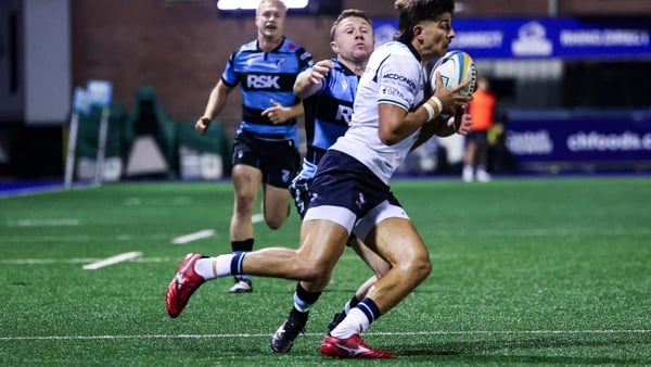 11 October 2025; Chay Mullins of Connacht Rugby is held by Tom Bowen of Cardiff Rugby during the United Rugby Championship match between Cardiff Rugby and Connacht at Cardiff Arms Park in Wales. Photo by Gareth Everett/Sportsfile
